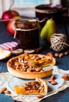 slice of tart with pear jam, apples and caramel photo