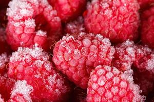 Frozen raspberries background