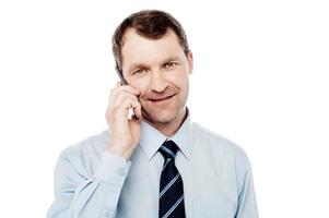 Male executive using is cell phone photo