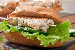 Big sandwich with chicken kebab and lettuce photo
