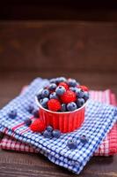 Raspberries and blueberries fruits.