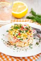 Fresh vegetable and crab salad with mayonnaise photo