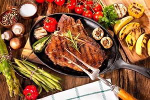 Beef steaks with grilled vegetables photo