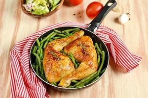 Roasted chicken legs with green beans photo