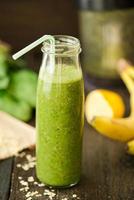 fresh detox green smoothie with spinach and outmeal photo
