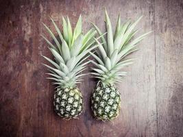 pineapple on wooden background photo