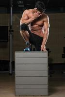 Man Resting After Performing A Box Jump photo