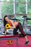 Sport woman exercising gym, fitness center photo