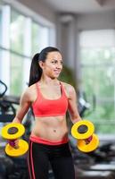 Sport woman exercising gym, fitness center photo