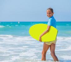 Girl with surf photo
