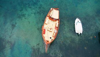 Aerial view of a wooden boat in the sea