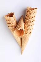 row of ice cream cones on white background