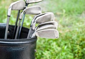 Close up of golf clubs in golf bag photo