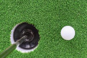 Golf ball and hole photo