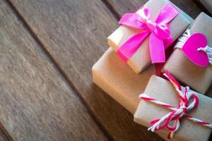 Gift box on wooden background photo