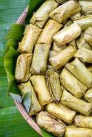 Sticky rice steamed in banana leaf