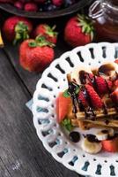 sweet waffles with fruits and chocolate photo