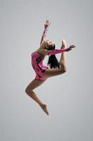 Caucasian girl gymnast jumping