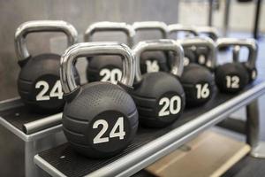Heavy kettlebells weights in a workout gym photo