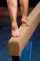 Gymnast walking on tiptoes down balance beam (XXXL)