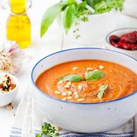 Tomato soup with sun dried tomatoes and olive oil photo