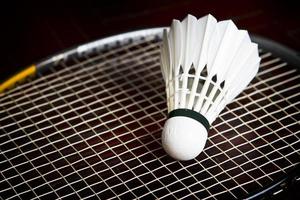 Shuttlecock on badminton racket. photo