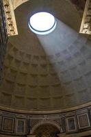 Shaft of light shining through oculus of Pantheon photo