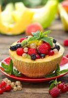Fresh fruit salad in the melon photo