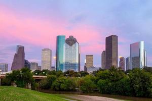 Houston Texas  skyline at sunset twilight from park lawn
