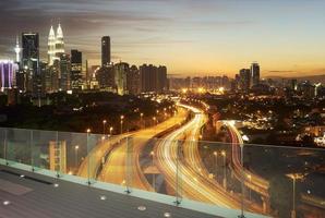 Dramatic scenery of the Kuala Lumpur city at sunset photo