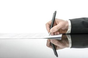 Signing contract on a black table photo