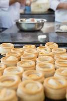 Colleagues making vol-au-vent together photo