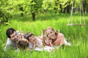 Happy family having picnic in nature