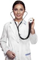 Female doctor examing with stethoscope photo