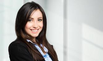 Smiling young female manager portrait photo