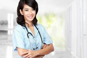 beauty female doctor with arm crossed photo