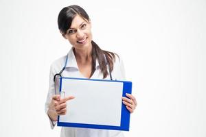 Female doctor pointing finger on clipboard