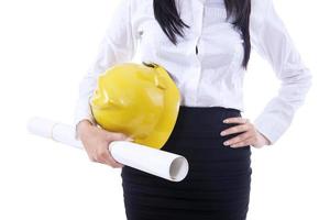 Businesswoman yellow hat and plan photo