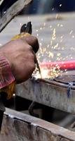 Dangerous welding without protective work wear photo