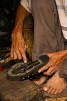 Hands repairing shoes, Kathmandu, Nepal