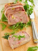 Duck terrine with pistachios and cherries. photo