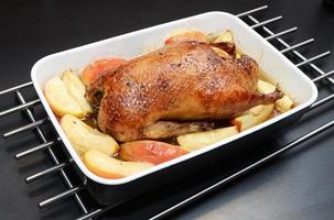 Roasted duck, stuffed with apples and honey. photo