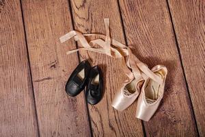 Gym shoes and ballet pointe shoes. photo