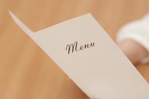 Woman holding a menu