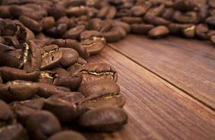 Coffee beans on wood background photo