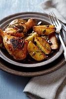 Oven-baked chicken and potatoes with pumpkin seeds photo