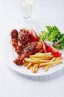 Grilled Chicken Legs with French Fries and Salad