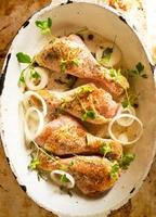 Raw chicken in frying pan photo