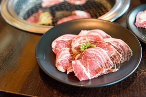Raw beef slice for barbecue or Japanese style yakiniku photo