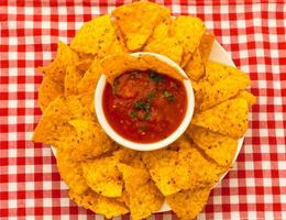 Salsa with tortilla chips photo